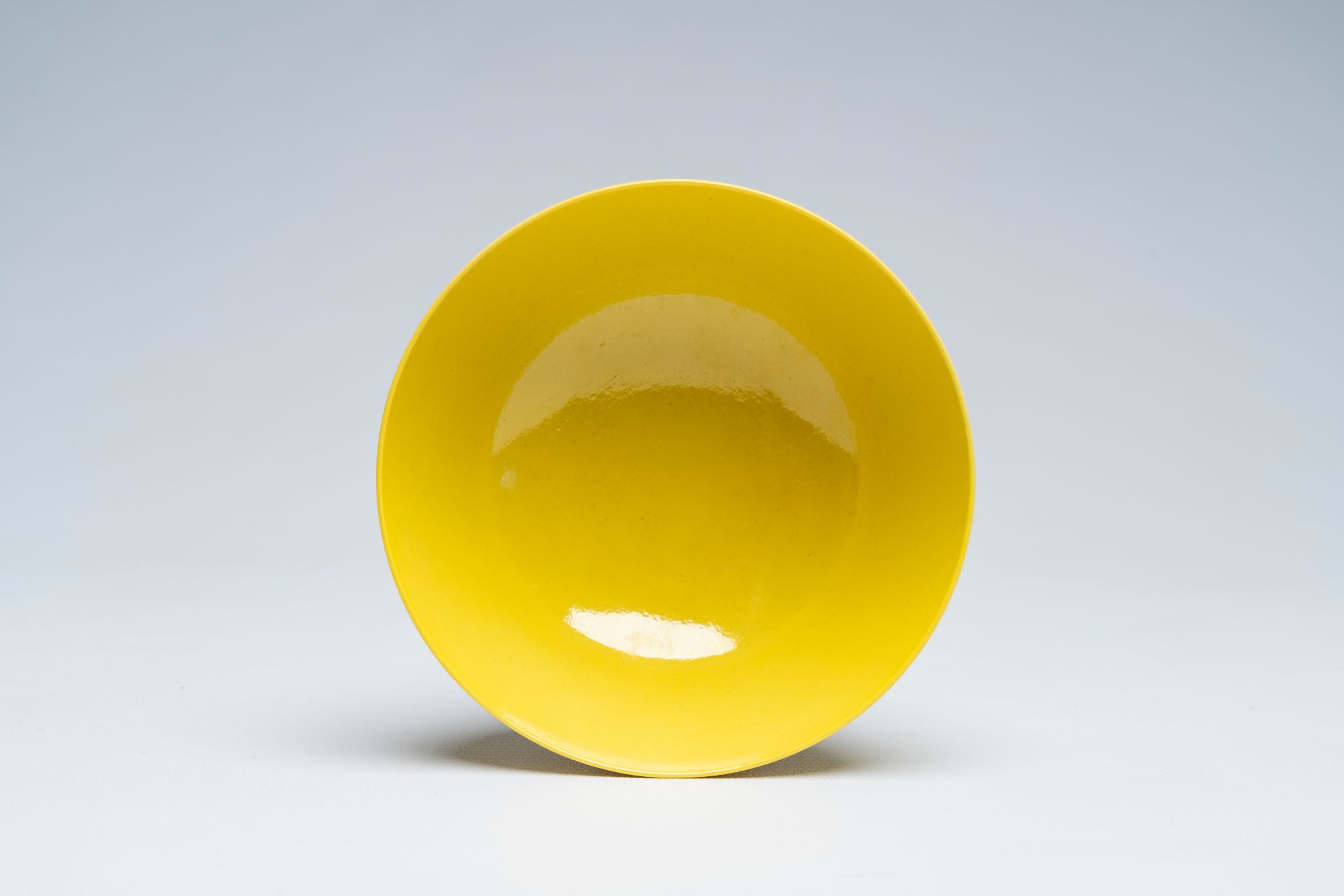 A Chinese monochrome yellow bowl, Qianlong mark, 19th/20th C. - Image 6 of 7