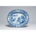 A lobed oval Chinese blue and white deep charger with an animated river landscape, Qianlong