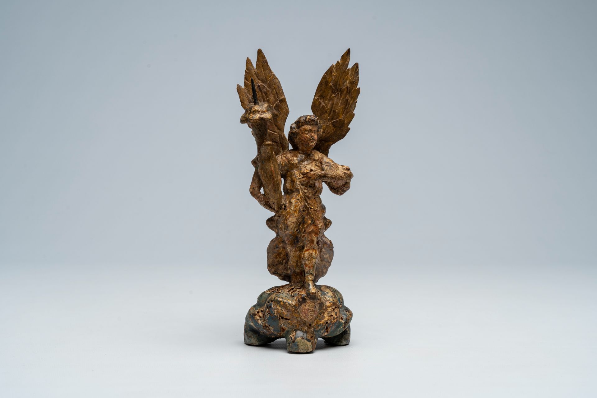 An Italian carved, polychrome painted and gilt wood archangel Michael shaped candlestick, 17th C. - Image 2 of 9