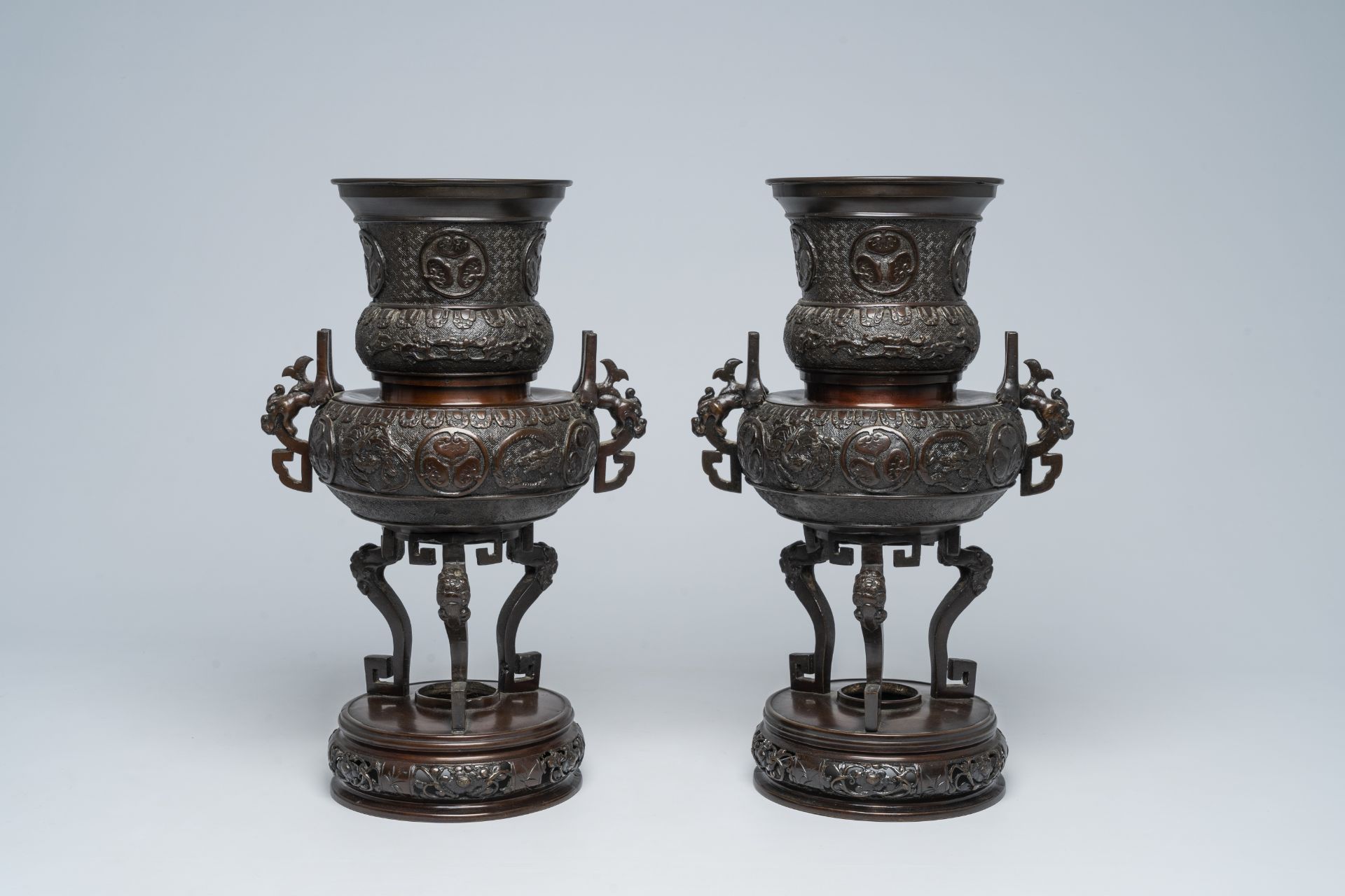 A pair of Japanese bronze vases with Tokugawa medallions in relief, Meiji, 19th C.