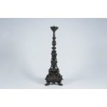 An impressive French patinated bronze candlestick with grotesques and mascarons, 20th C.