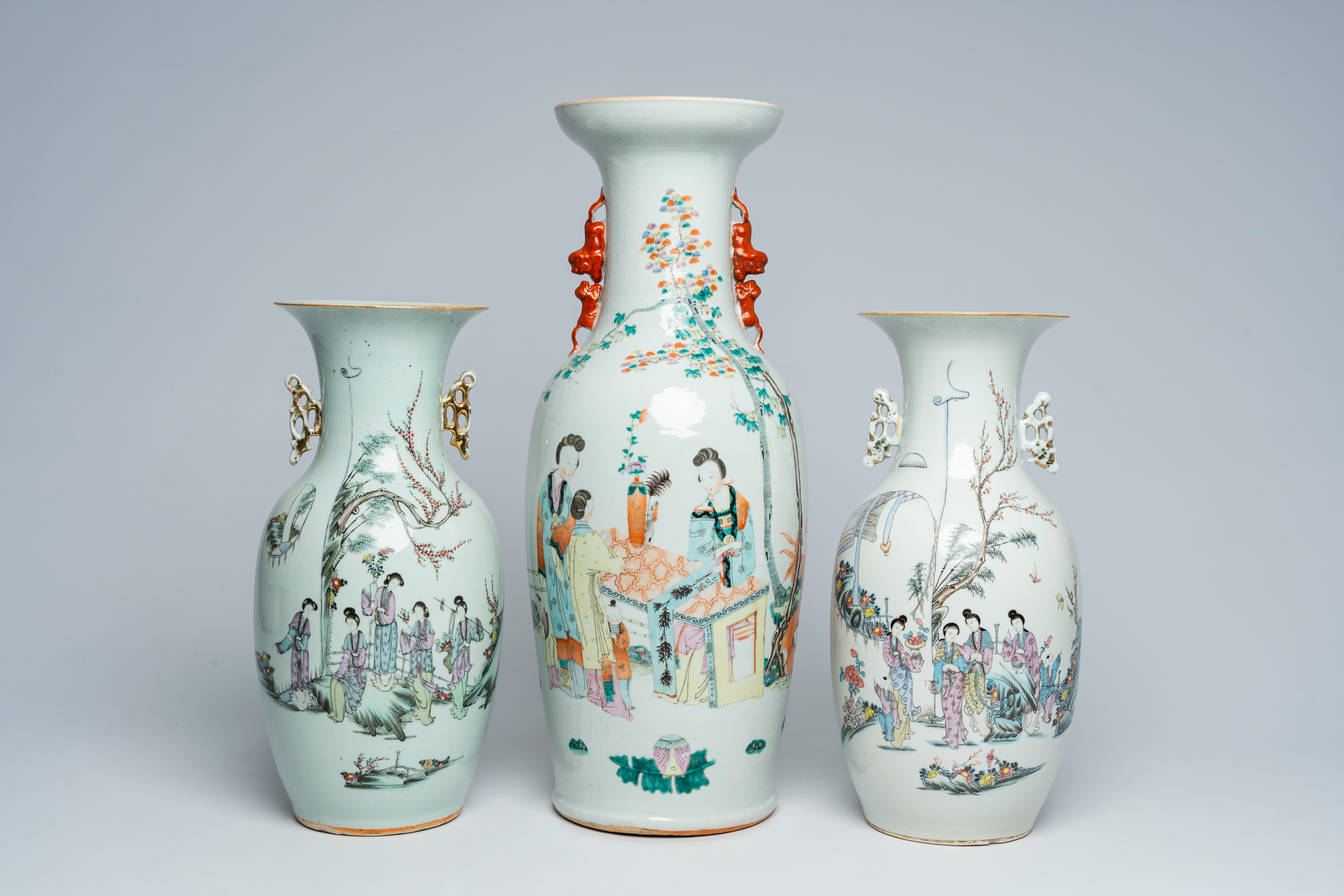 Three Chinese famille rose and qianjiang cai vases with ladies in a garden, 19th/20th C.