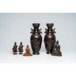 A pair of Japanese bronze vases with relief design and four bronze figures of Buddha, China and Sout