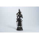 A large Nepalese patinated bronze figure of a standing Tara on a lotus throne, 19th/20th C.