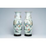 A pair of Chinese famille rose vases with playing children and goats in a landscape, 19th/20th C.