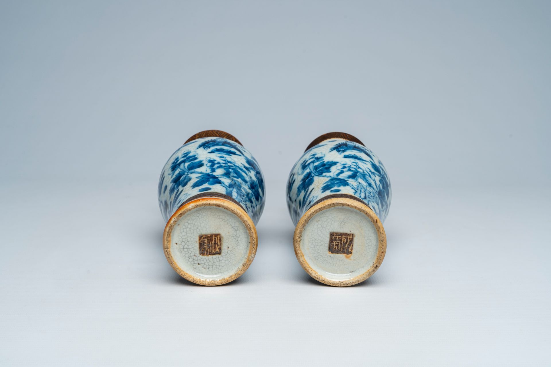 A pair of Chinese Nanking crackle glazed blue and white vases with birds and butterflies among bloss - Image 6 of 6