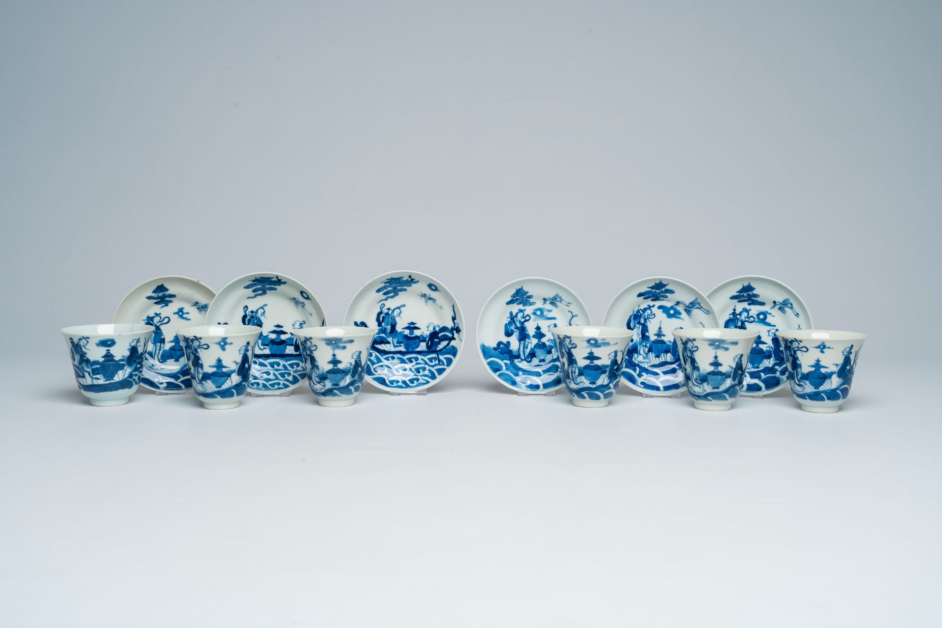 Six Chinese blue and white cups and saucers with Immortals in a boat, Daoguang