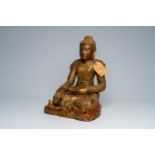 A tall Thai inlaid gilt wood figure of a seated Buddha, 20th C.