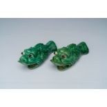 A pair of Chinese green glazed earthenware 'carp' wall vases, ca. 1900