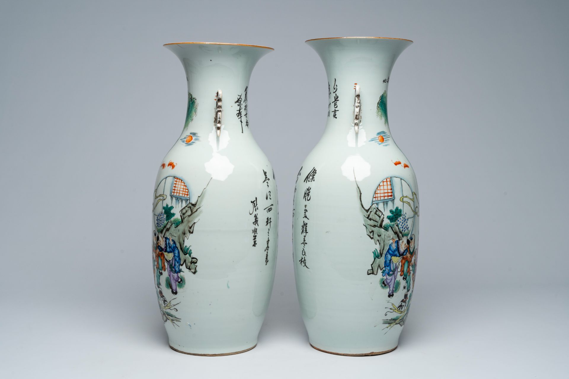 A pair of Chinese famille rose vases with a lady, playing children and a cat in a garden, 19th/20th - Image 2 of 5