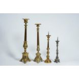 Four various brass and pewter church candlesticks, 19th/20th C.