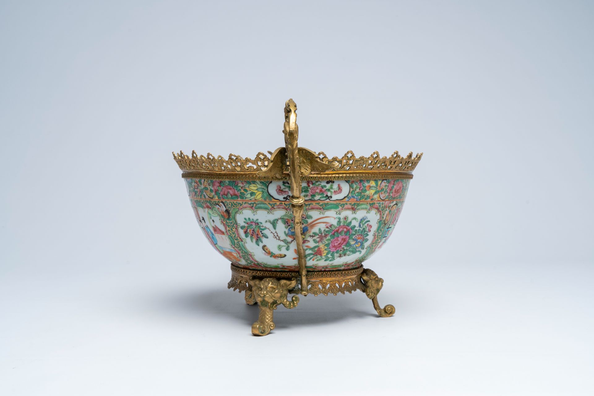 A Chinese Canton famille rose brass mounted bowl with palace scenes and floral design, 19th C. - Image 3 of 7