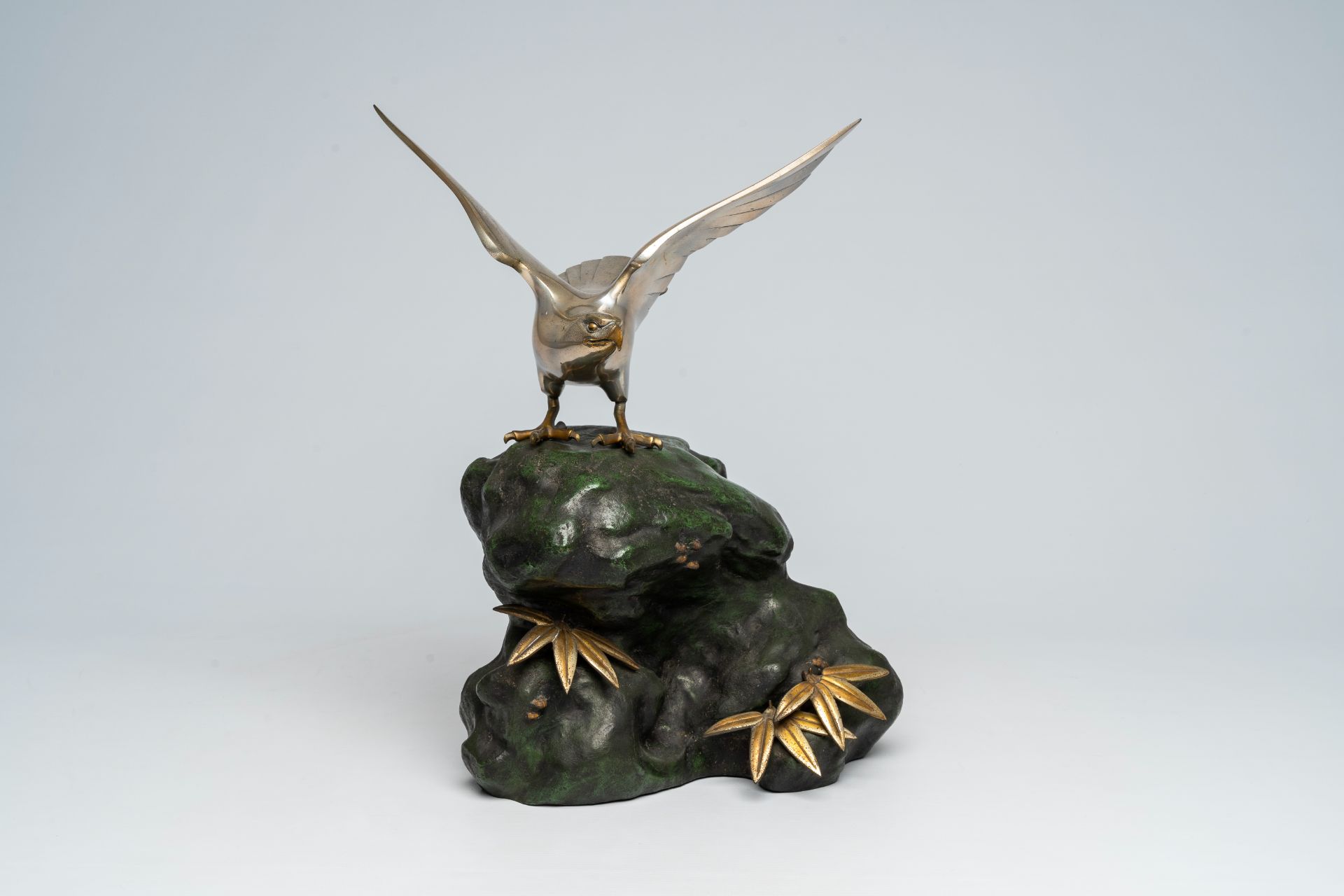 A Japanese patinated and silver-plated metal okimono of an eagle on a rock, signed Hidemasa, 20th C. - Image 11 of 17