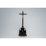 A Flemish ebonised wood silver-plated copper mounted crucifix, 19th C. and earlier