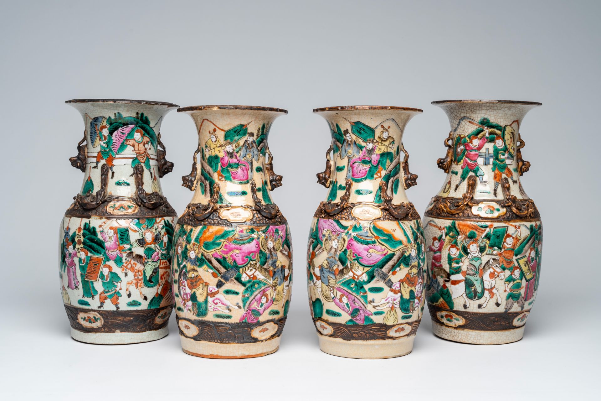 Four Chinese Nanking crackle glazed famille rose vases with warrior scenes, 19th C.