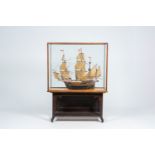 A painted wood model of a 16th-C. German galleon with glass display case, 20th C.