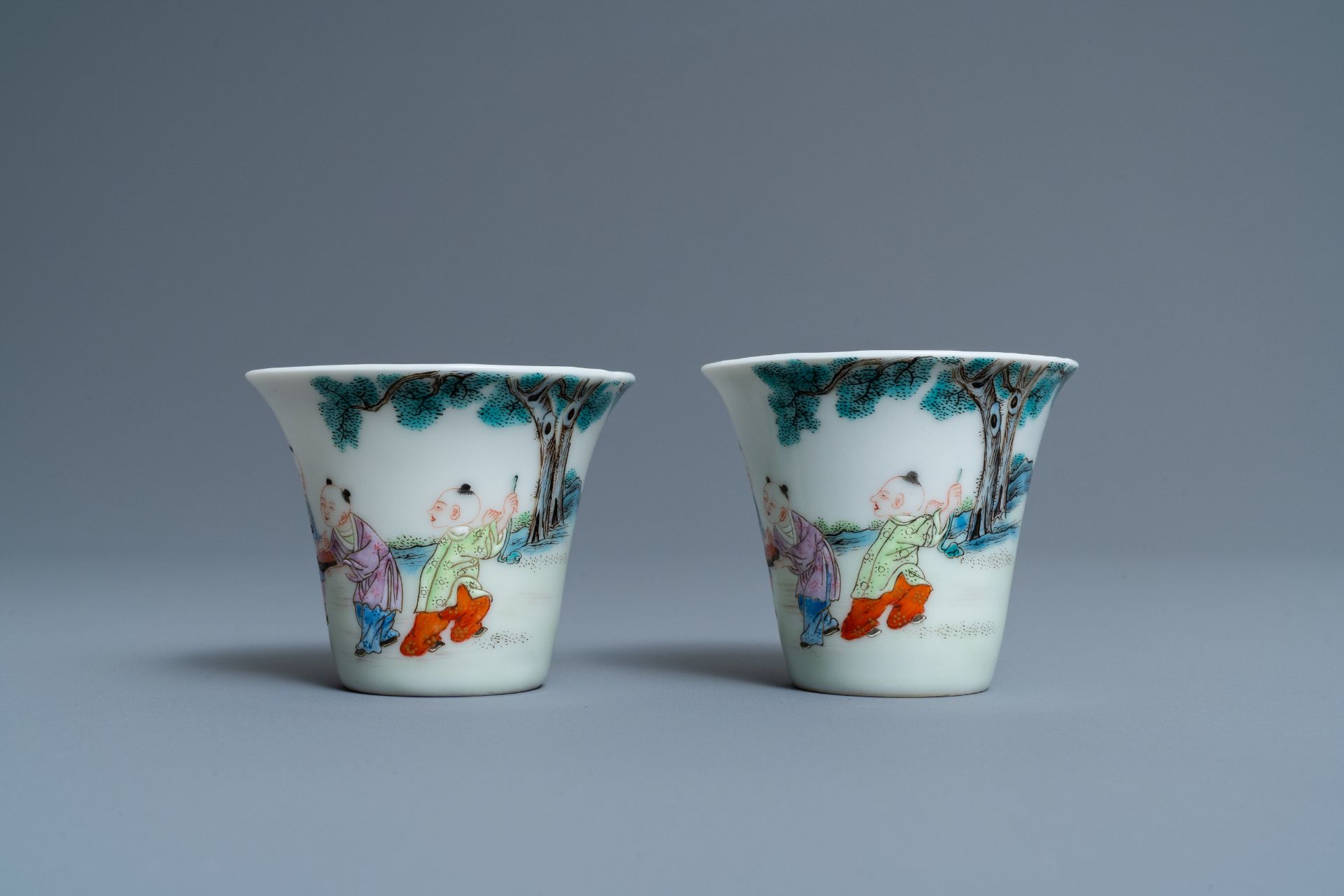 A pair of Chinese famille rose 'playing boys' wine cups, Qianlong mark, Republic, 20th C. - Image 5 of 7