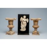 A pair of Italian Medici alabaster 'mascaron' vases and a marble angel, 19th/20th C.