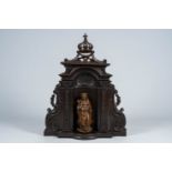 A presumably French eclectic patinated wood shrine with a Virgin and Child, 19th C.