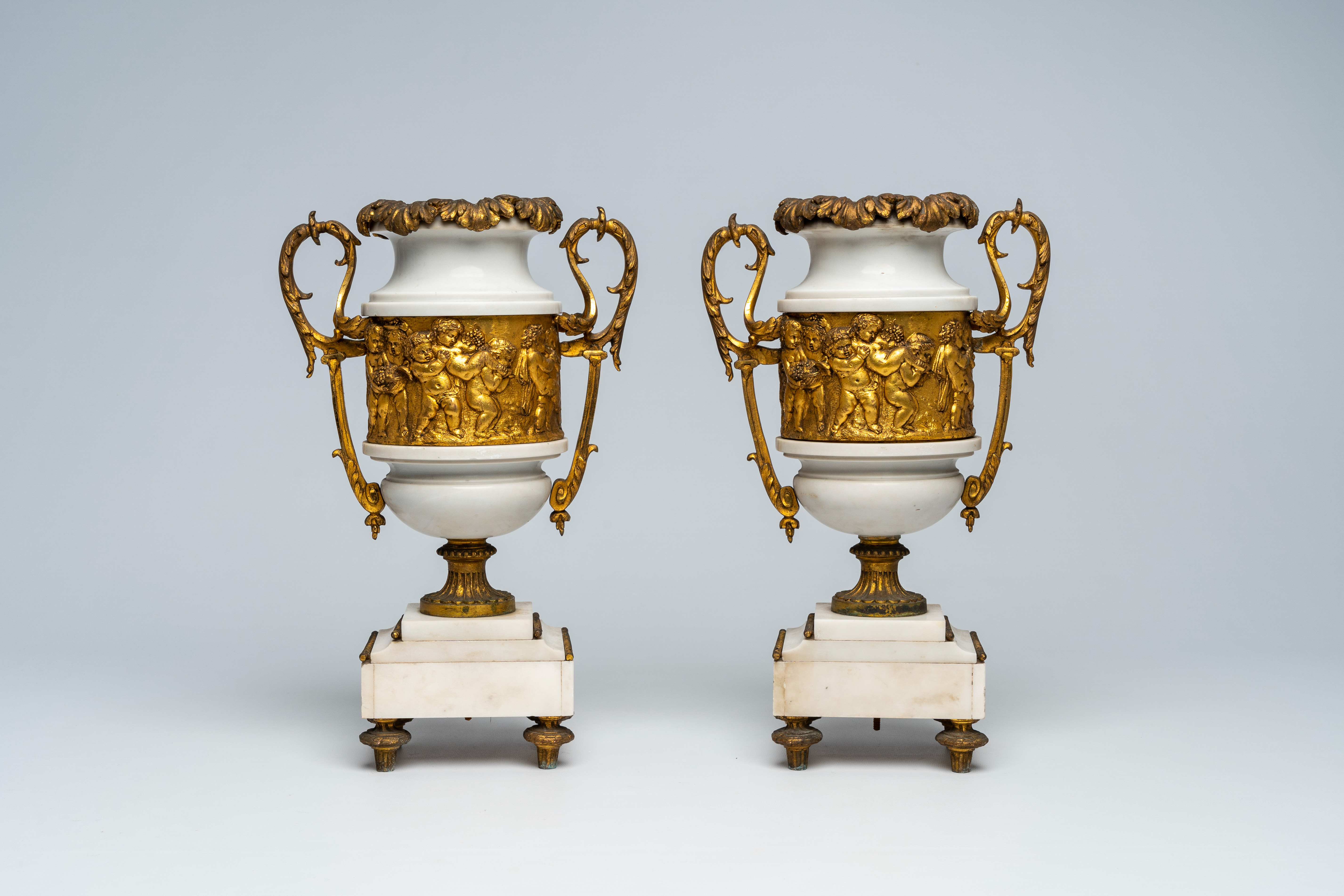 A pair of French gilt mounted white marble vases with relief design of putti, goats and Bacchus them - Image 3 of 7