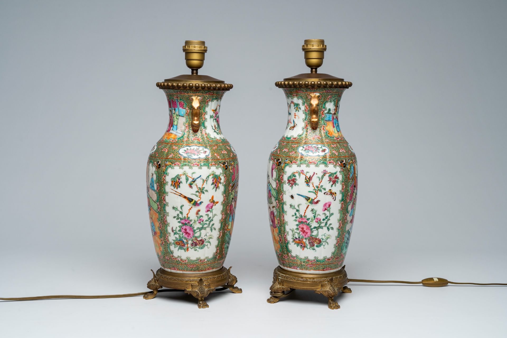 A pair of Chinese Canton famille rose vases with palace scenes mounted as lamps, 19th C. - Image 5 of 7