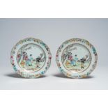 A pair of fine Chinese famille rose plates with figures in a garden, Qianlong