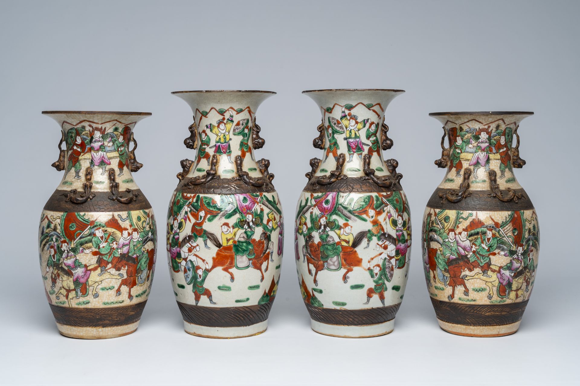 Two pairs of Chinese Nanking crackle glazed famille rose 'warrior' vases, 19th C.