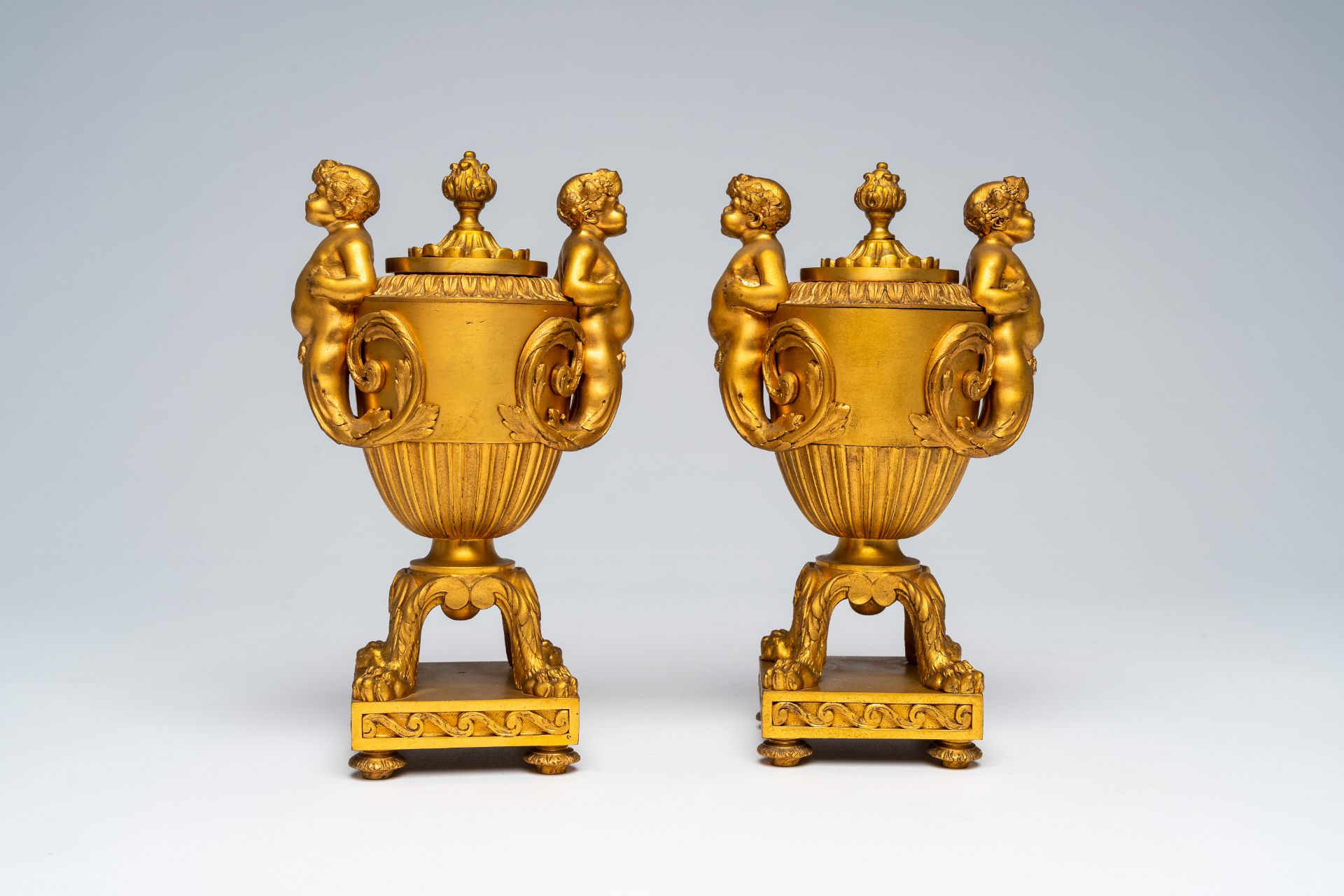 A pair of French gilt bronze vases and covers with bacchantes and lion's feet convertible into candl - Image 5 of 8