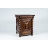 A Flemish oak single-door cupboard composed of Renaissance ornaments, 19th C.