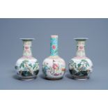 A pair of Chinese bottle shaped famille rose vases with an animated landscape and a vase with figura