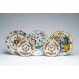 Three Dutch Delft polychrome chargers and two plates with floral design, 18th C.