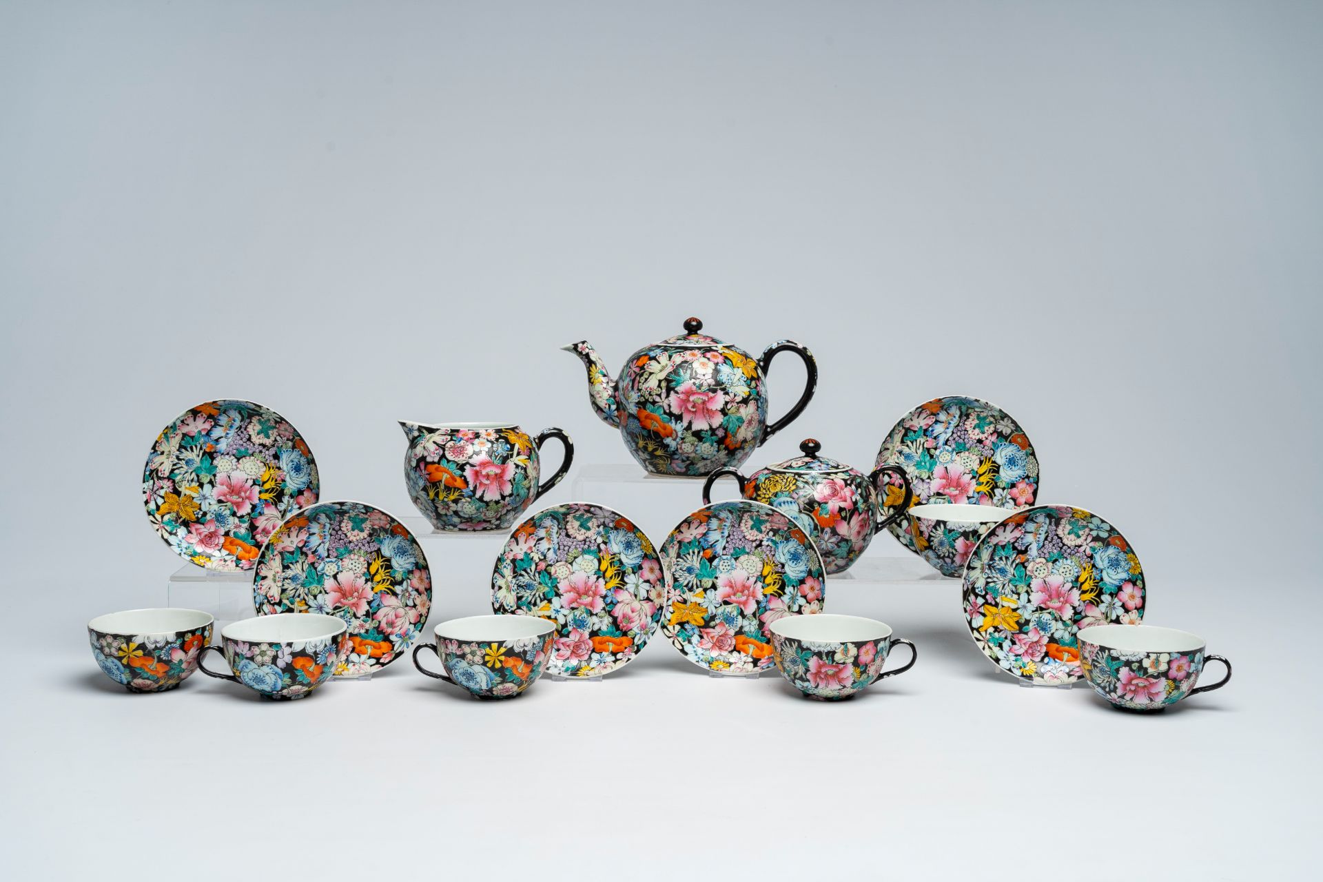 A Chinese fifteen-piece famille rose 'millefleurs' tea set with matching case, Guangxu mark, 20th C. - Image 5 of 20