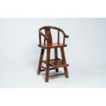 A Chinese wood children's horseshoe back chair, first half 20th C.