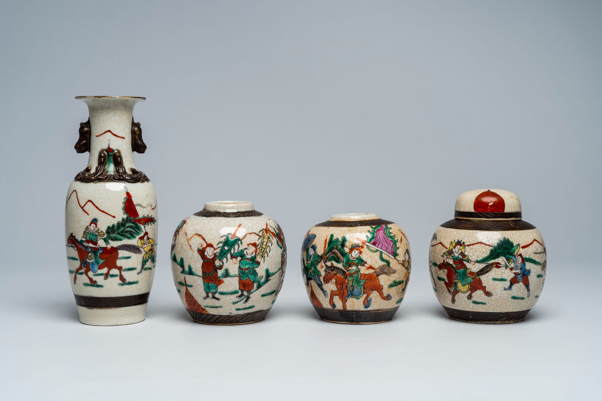 A varied collection of Chinese Nanking crackle glazed famille rose and verte vases and jars with war - Image 8 of 13