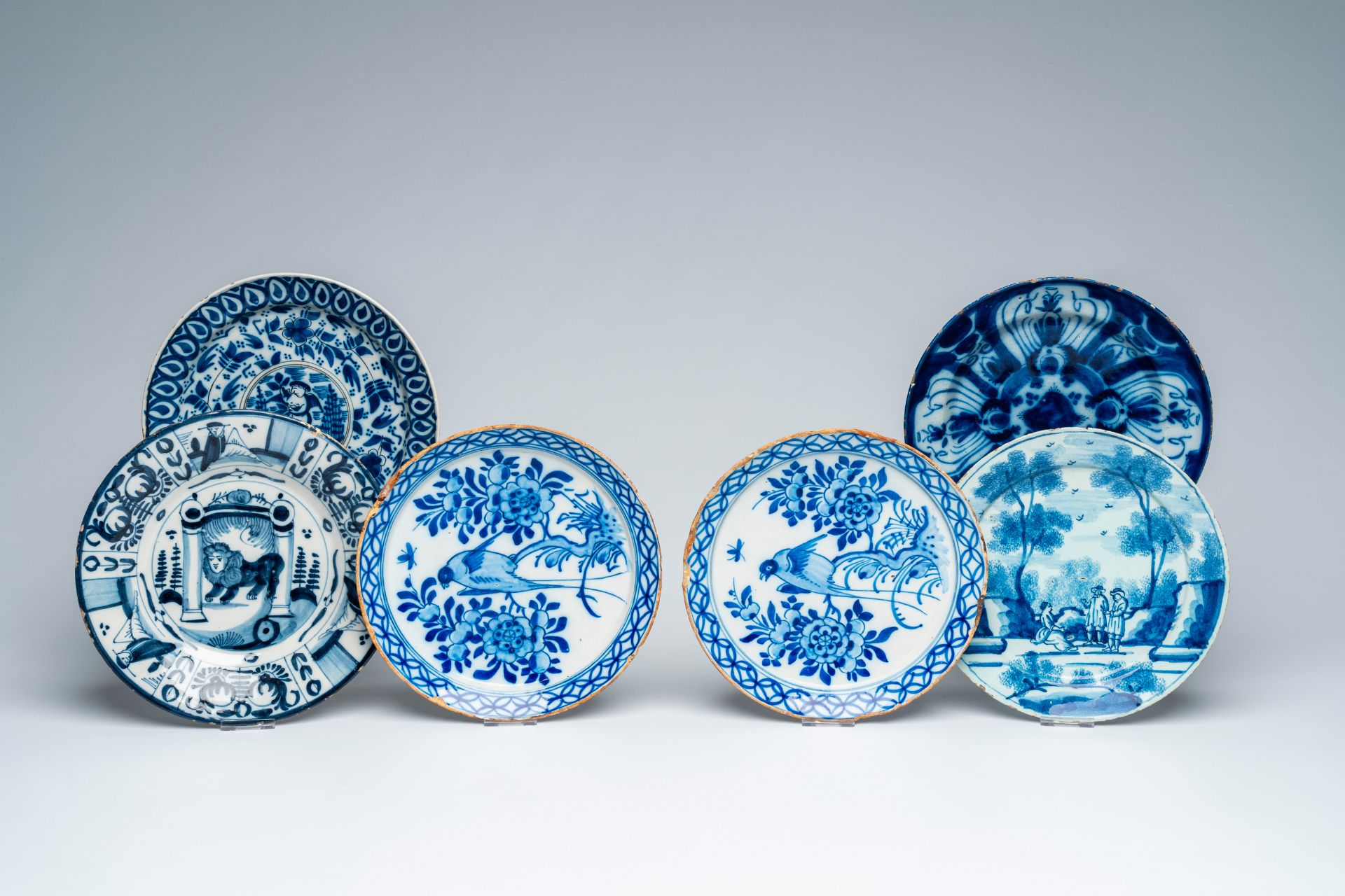 Six various Dutch Delft blue and white dishes, 18th C.