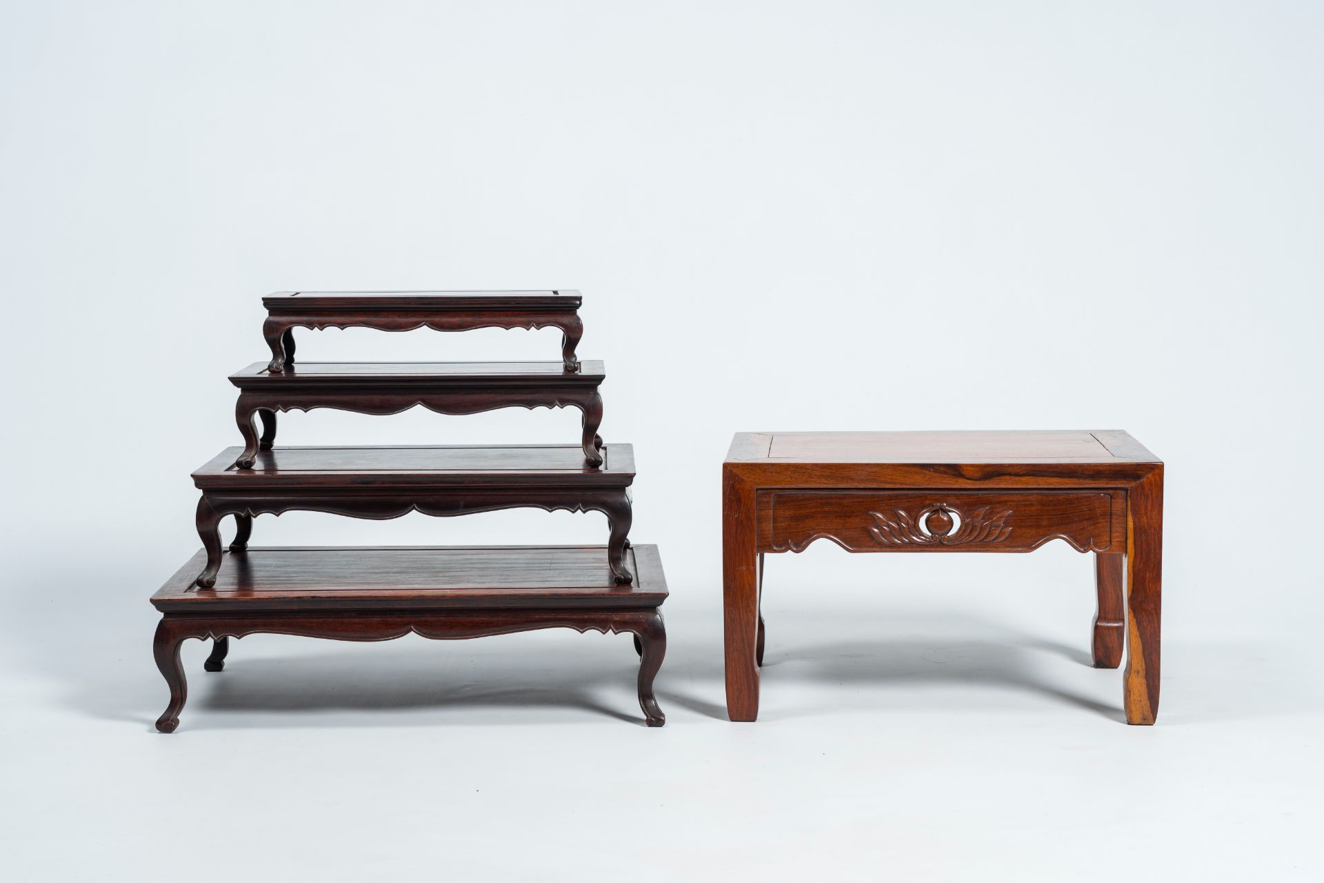 Four Chinese rectangular wood nesting tables and a side table with floral design, 20th C. - Image 5 of 8