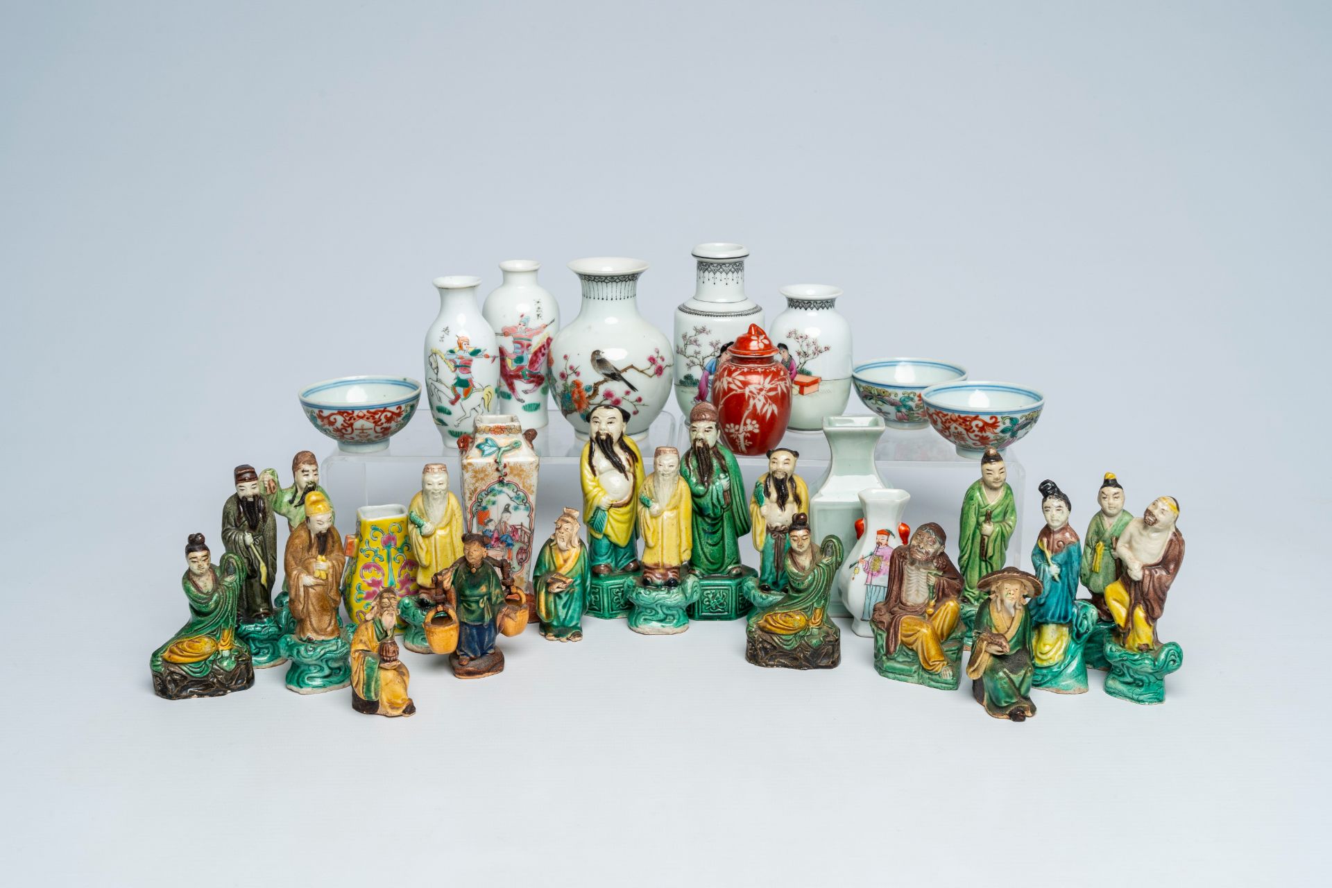 A varied collection of Chinese famille rose and celadon doll's house miniature vases and sancai glaz