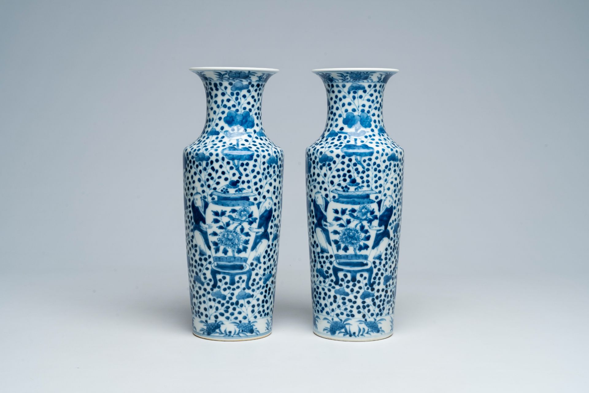 A pair of Chinese blue and white vases with boys and antiquities, Kangxi mark, 19th C.