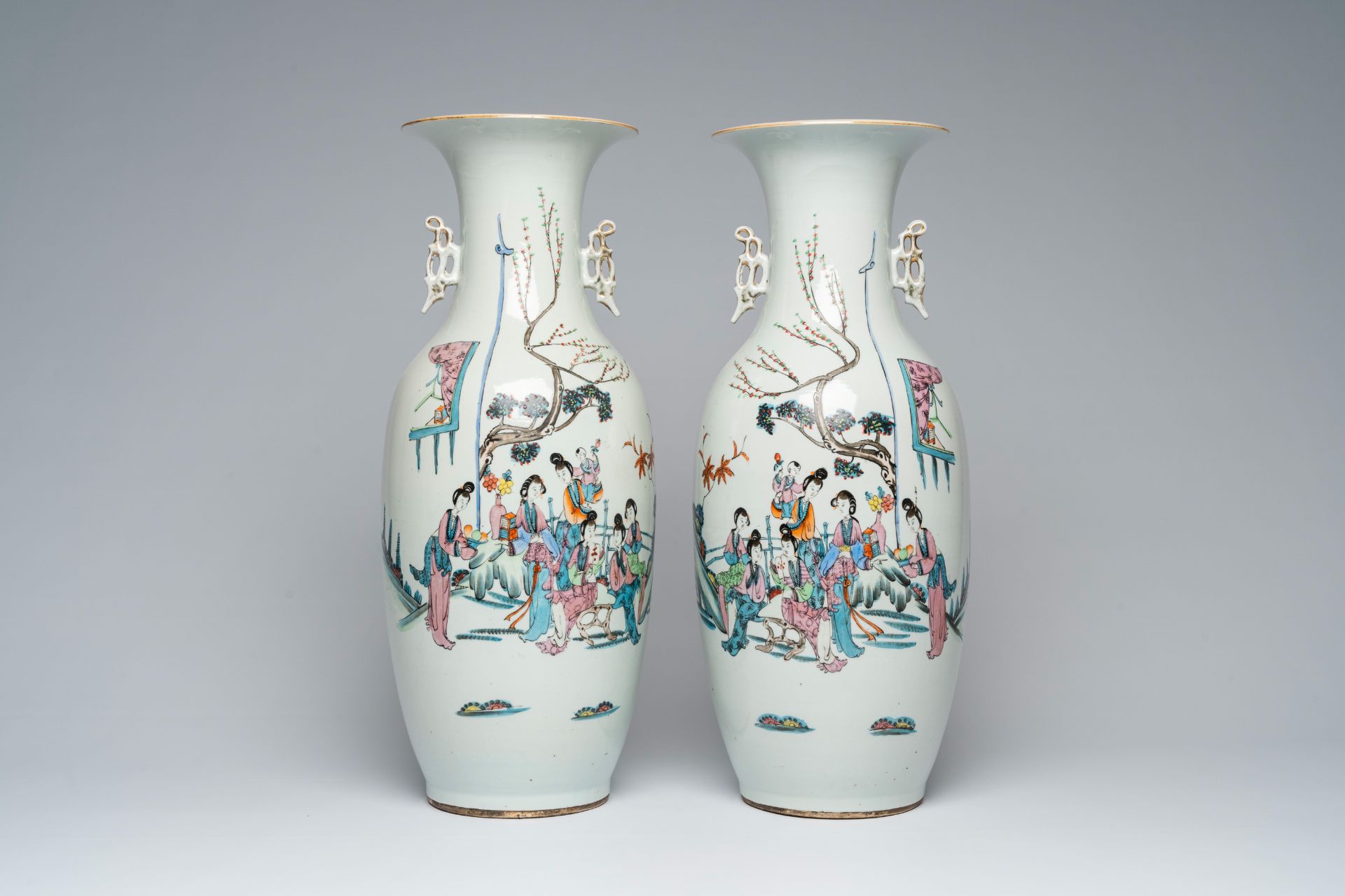 A pair of Chinese famille rose vases with ladies in a garden, 19th/20th C.