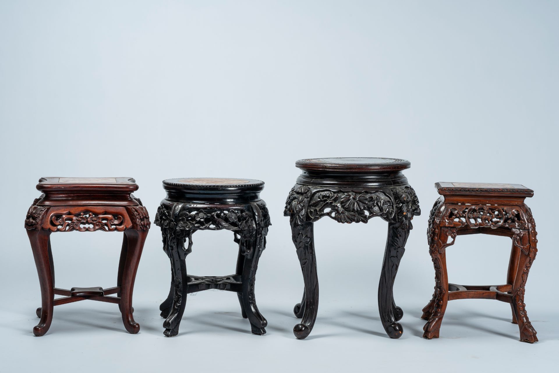 Four Chinese and Japanese open worked carved wood stands with marble and wood top, 20th C. - Image 4 of 7