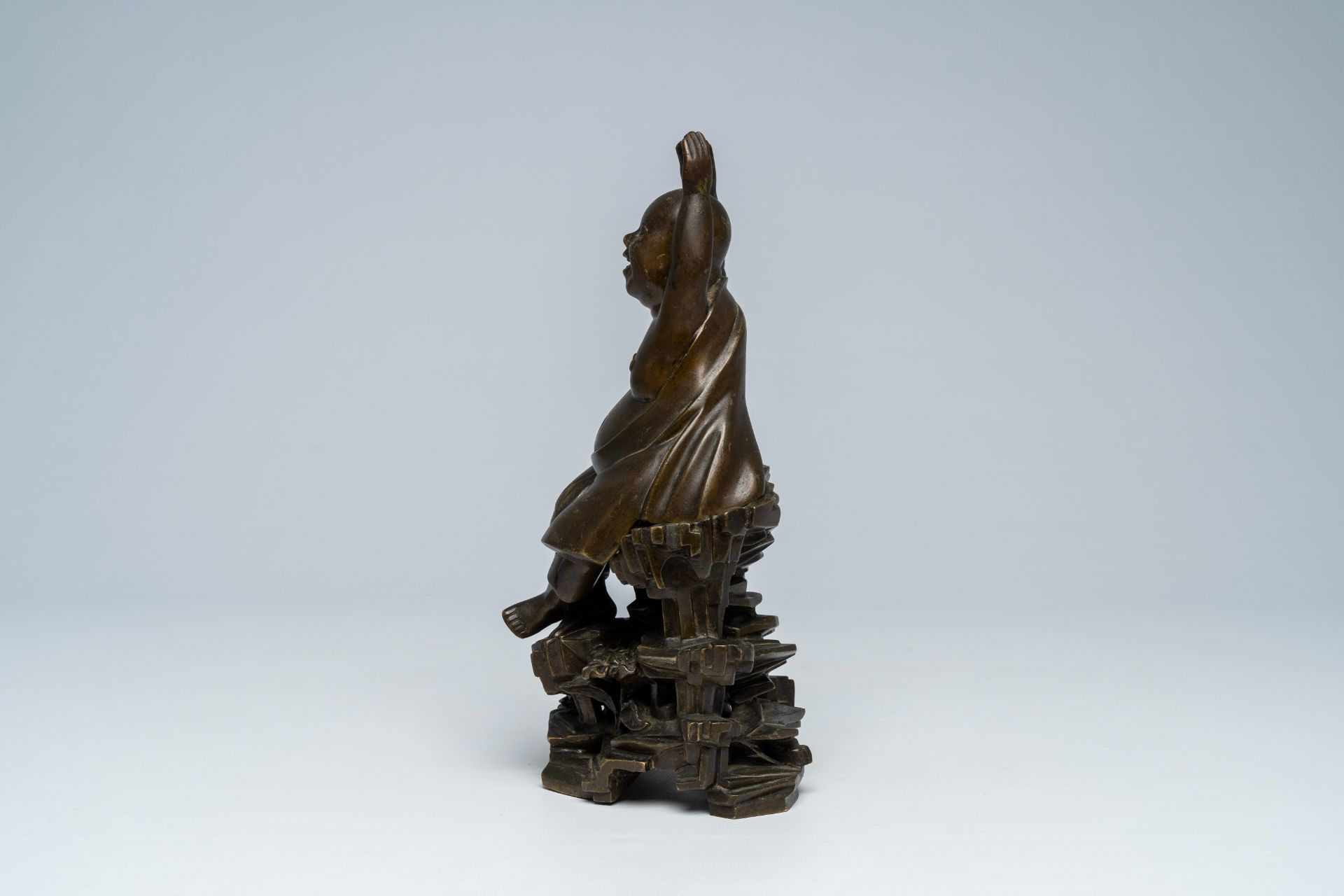 A Vietnamese bronze figure of Buddha seated on a rock, 19th C. - Image 3 of 7