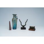 A varied collection of archaeological finds and a blue glass bottle with glass thread design, possib