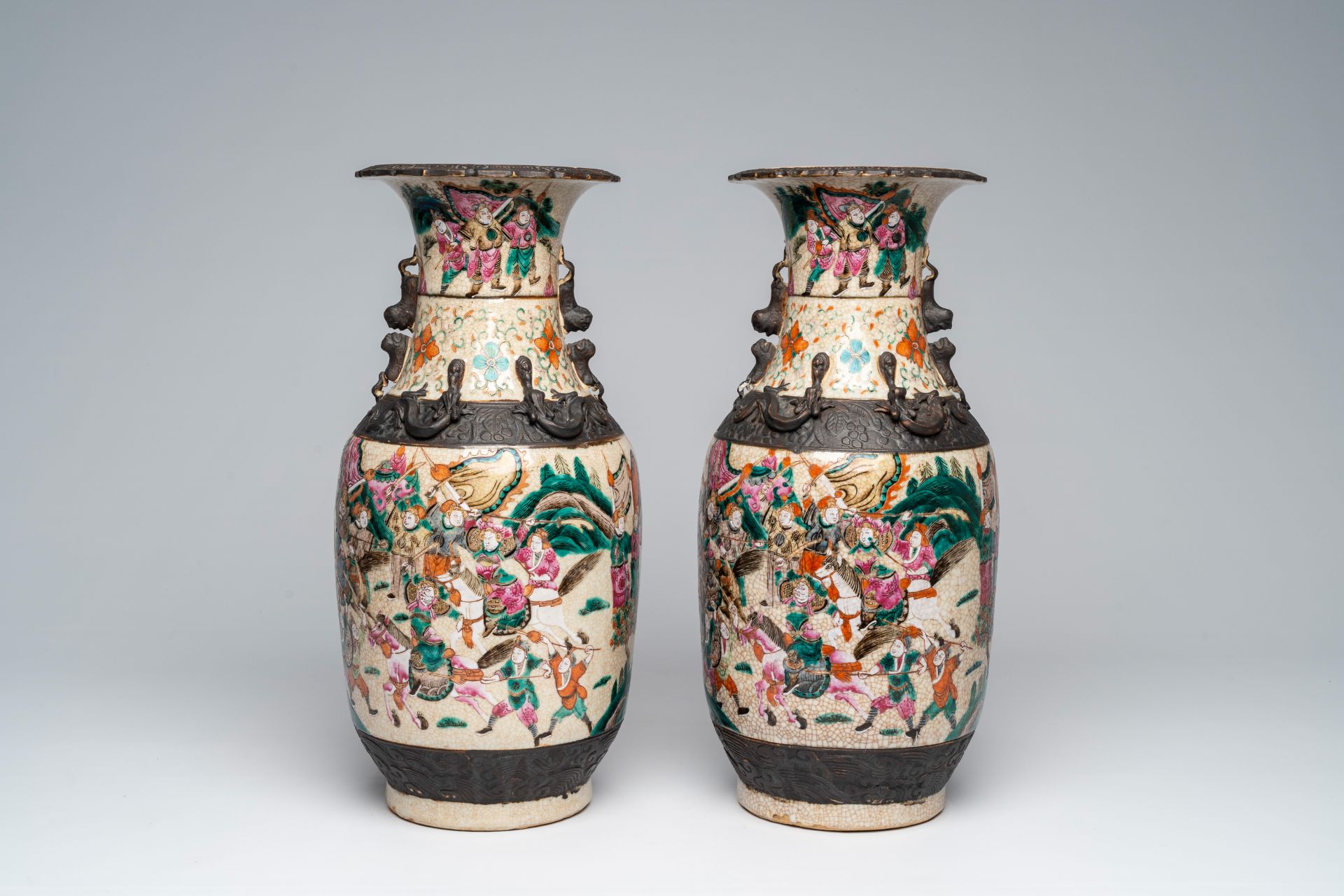 A pair of Chinese Nanking crackle glazed famille rose 'warrior' vases, 19th C. - Image 2 of 6