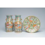 A pair of Chinese Canton famille rose vases with palace scenes and a charger with floral design, 19t