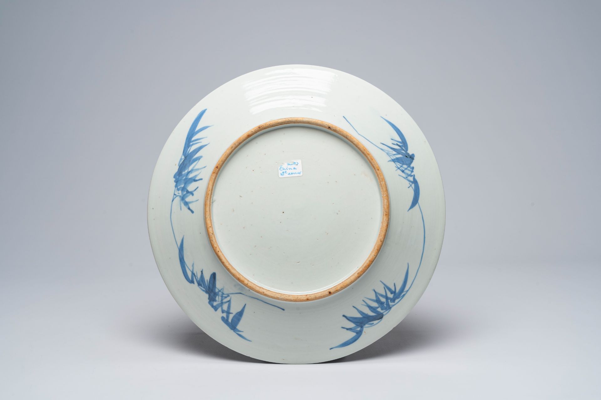 Two Chinese blue and white chargers with a landscape and antiquities, 19th C. - Image 3 of 5