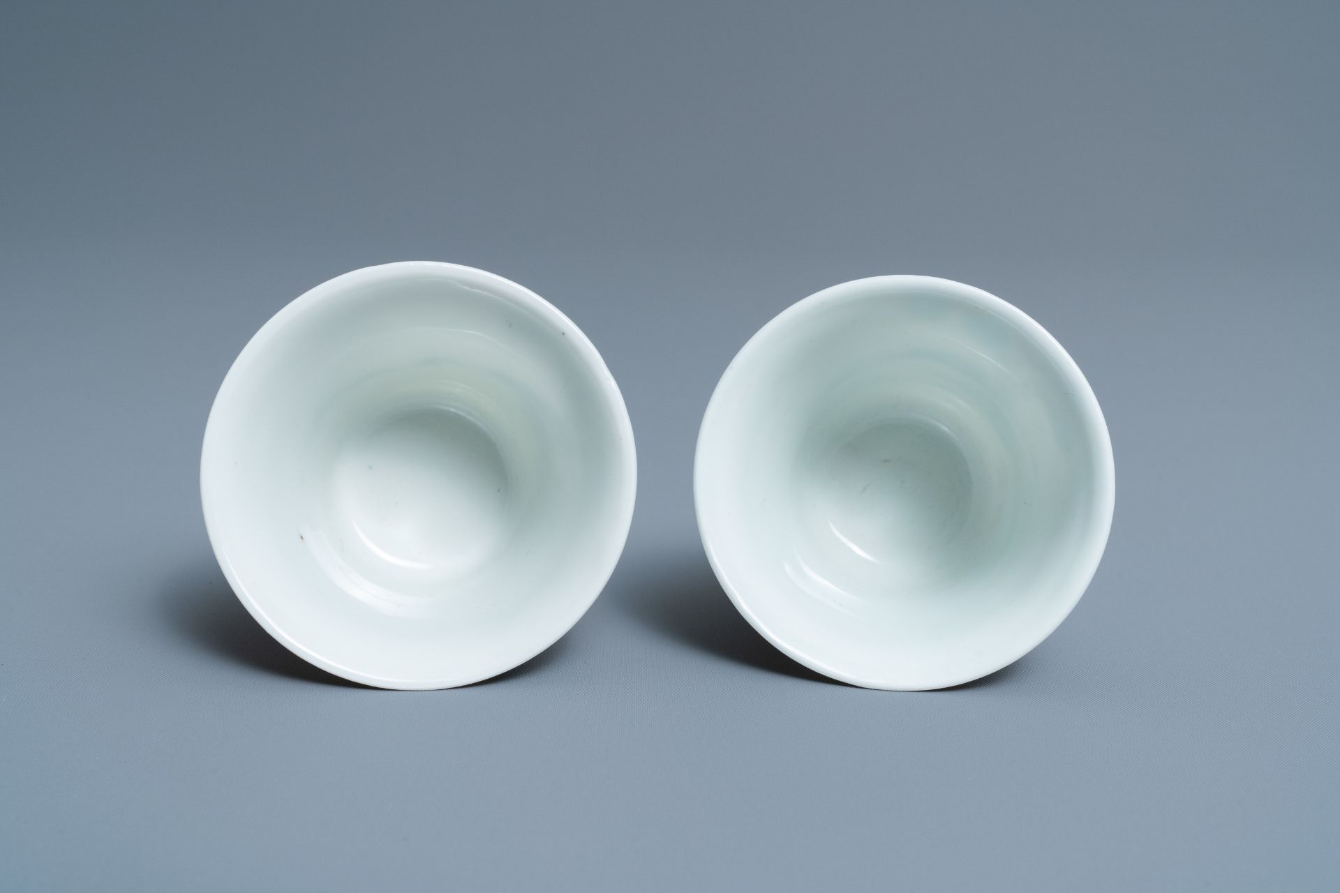 A pair of Chinese famille rose 'playing boys' wine cups, Qianlong mark, Republic, 20th C. - Image 6 of 7