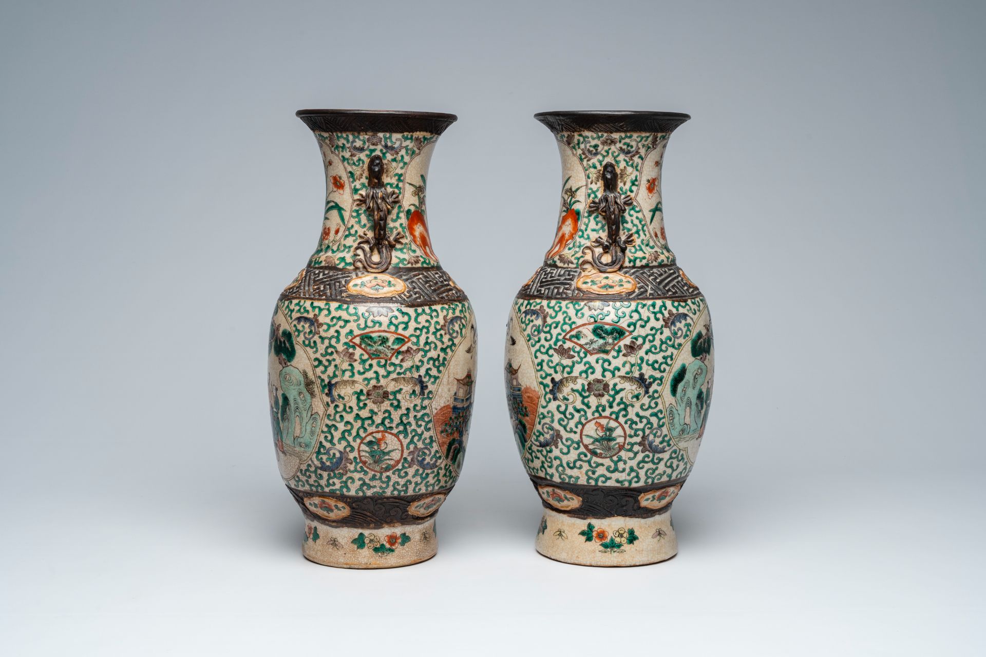 A pair of Chinese Nanking crackle glazed famille verte 'Immortals' vases, 19th C. - Image 4 of 6