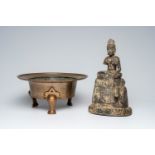 A Korean bronze tripod censer and an iron model of Guanyin, 19th C. or earlier