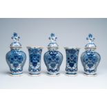 A Dutch Delft blue and white five-piece 'peacock tail' vase garniture, 18th C.