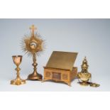 A French Gothic revival silver and brass chalice with enamel plaques, a brass reliquary, a lectern a